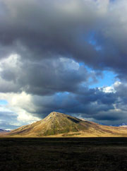 Mountain crushed by sky, Yukon Territory